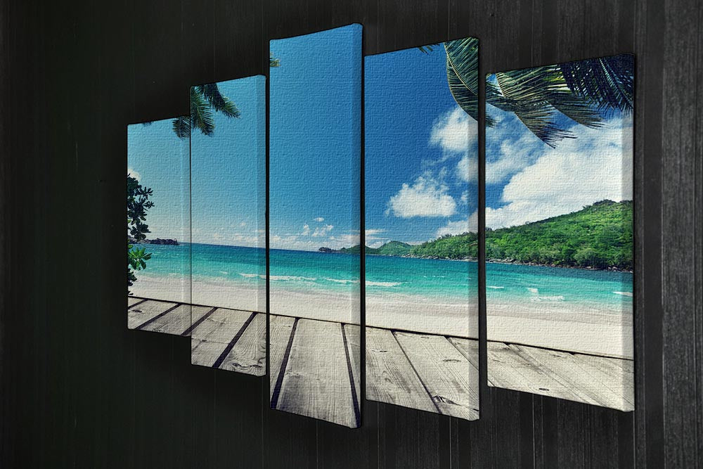 A beautiful 5-panel canvas artwork depicting Seychelles beach with a wooden pier, showcasing vibrant colors and serene ocean views.