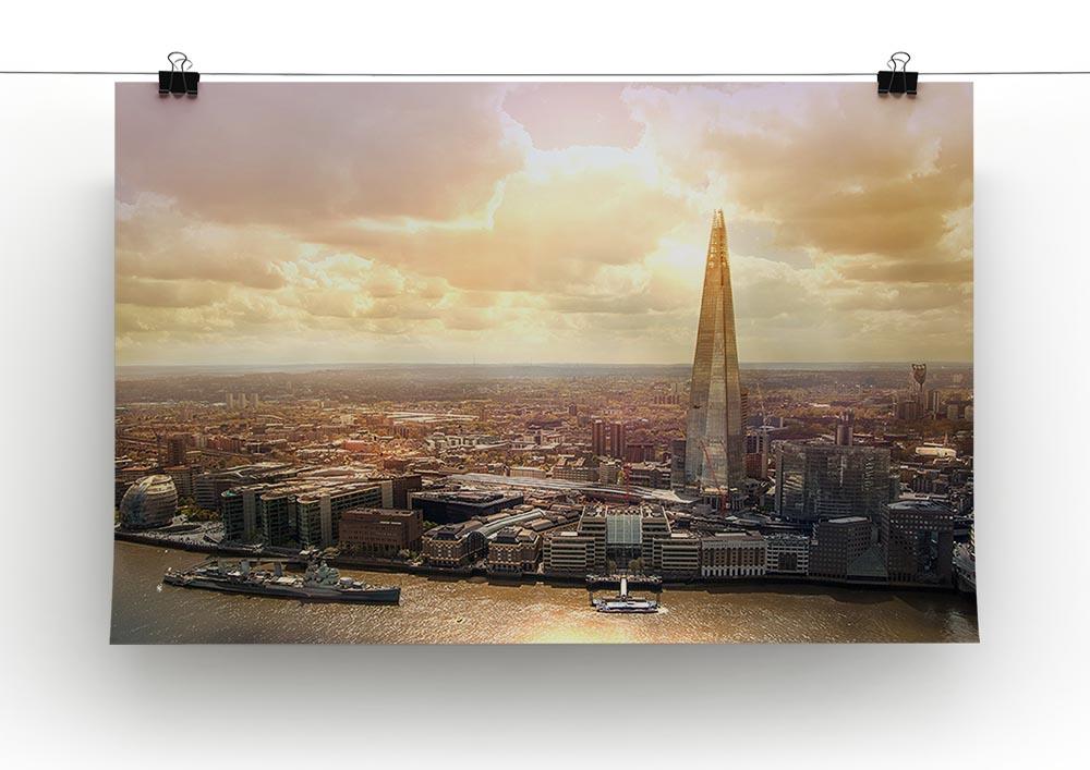 A beautiful canvas print of a shard of glass reflecting a vibrant sunset, showcasing rich colors and intricate details.