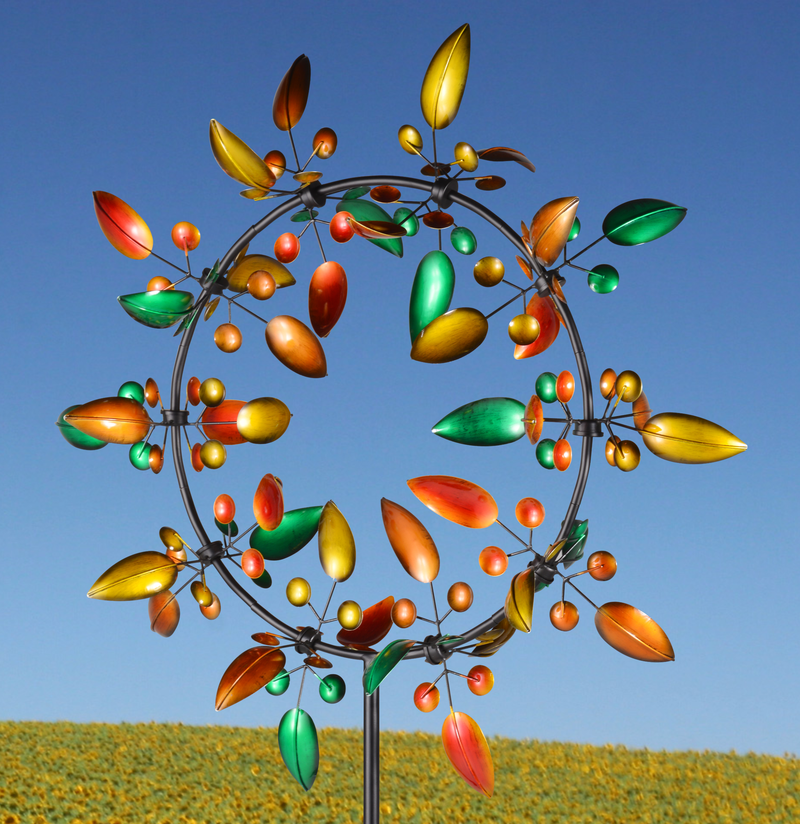 Sherborne garden wind sculpture spinner featuring autumnal leaves, standing 2.4m tall with vibrant colors and intricate design.
