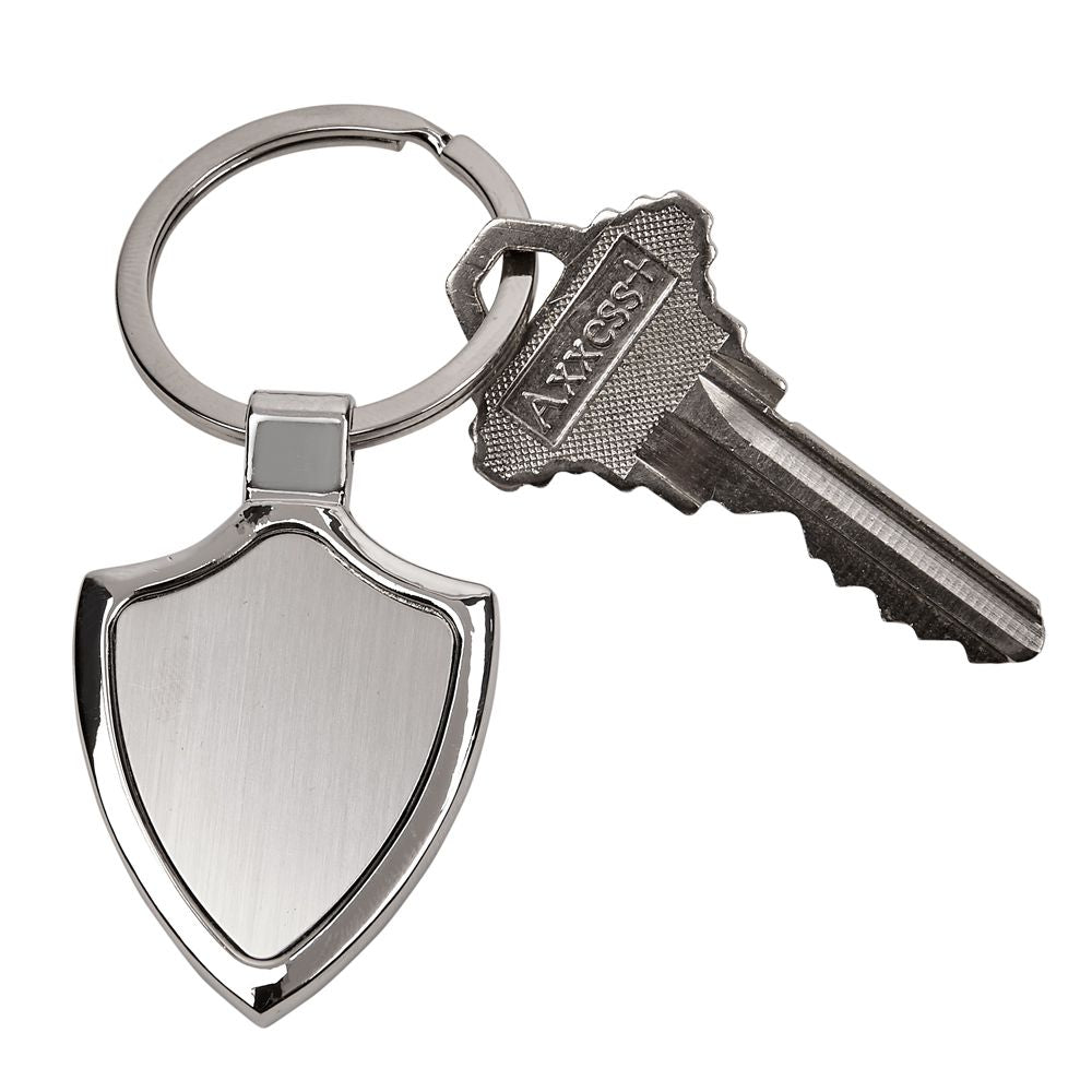A 3-inch shield keychain with a bright silver nickel plated edge and brushed finish interior, perfect for keys or as a decorative accessory.