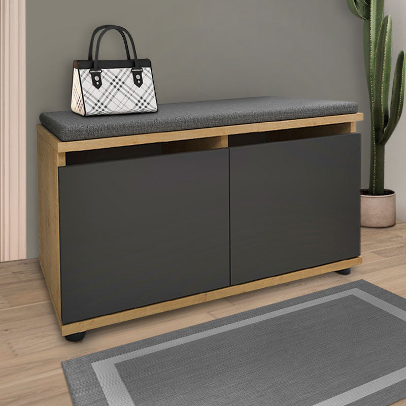CARMA shoe rack in oak finish with a comfortable anthracite seat cushion, designed to hold 8 pairs of shoes.