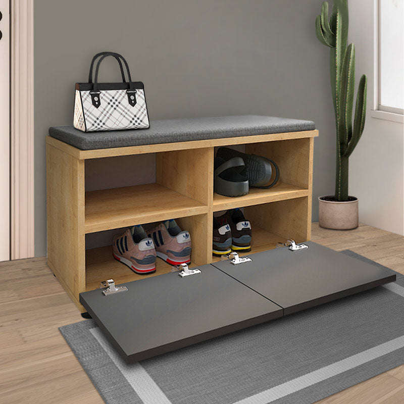 CARMA shoe rack in oak finish with a comfortable anthracite seat cushion, designed to hold 8 pairs of shoes.
