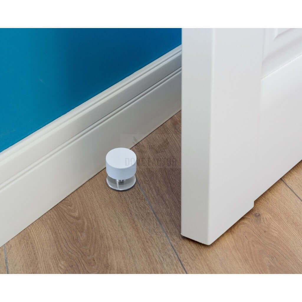 Short white door stop with screws, made of stainless steel, designed for wall and floor protection, featuring a sleek and modern aesthetic.