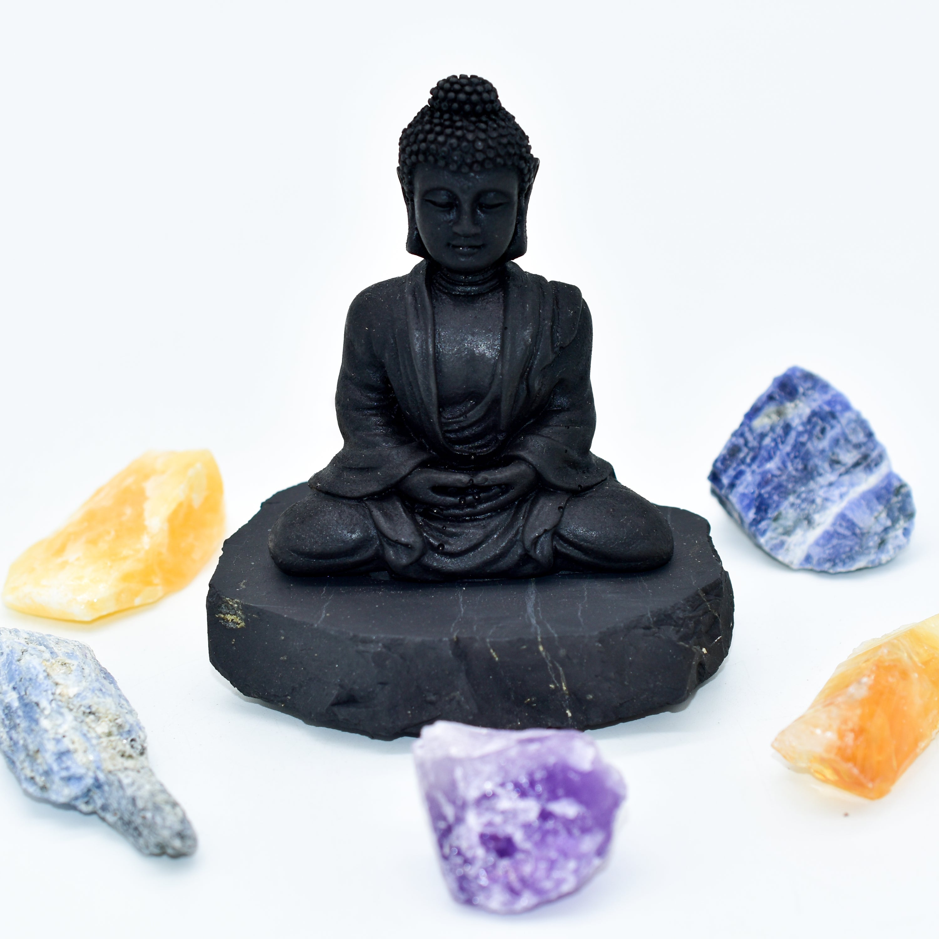 A natural Shungite Buddha figurine sitting gracefully, showcasing its unique texture and dark color, perfect for EMF protection.
