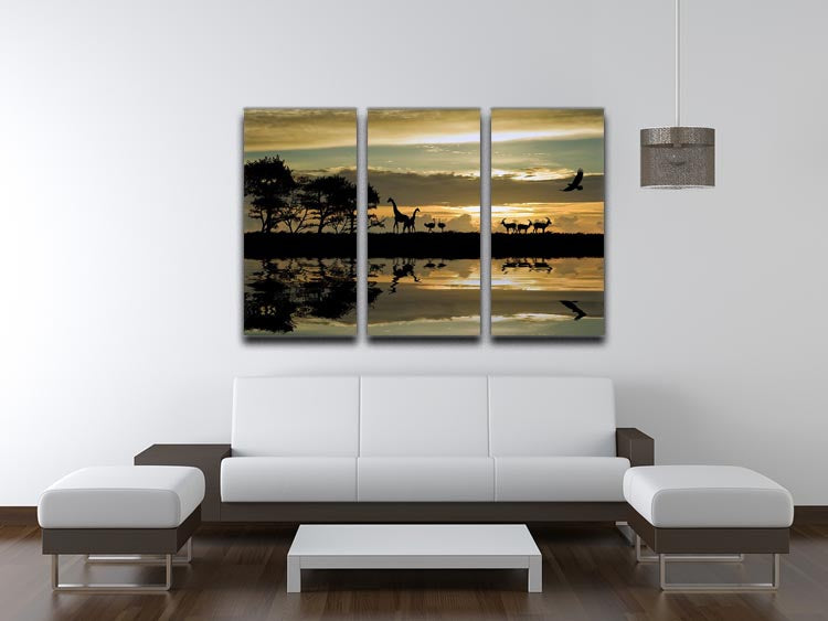 A beautiful 3-panel canvas print featuring silhouettes of African animals against a vibrant background, perfect for home decor.