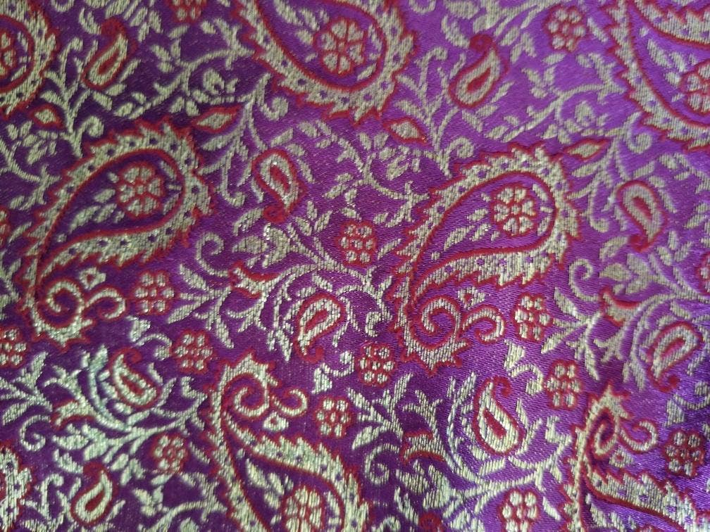 Luxurious silk neck pillow filled with organic buckwheat hulls, designed for neck support and relaxation during yoga and restorative practices.