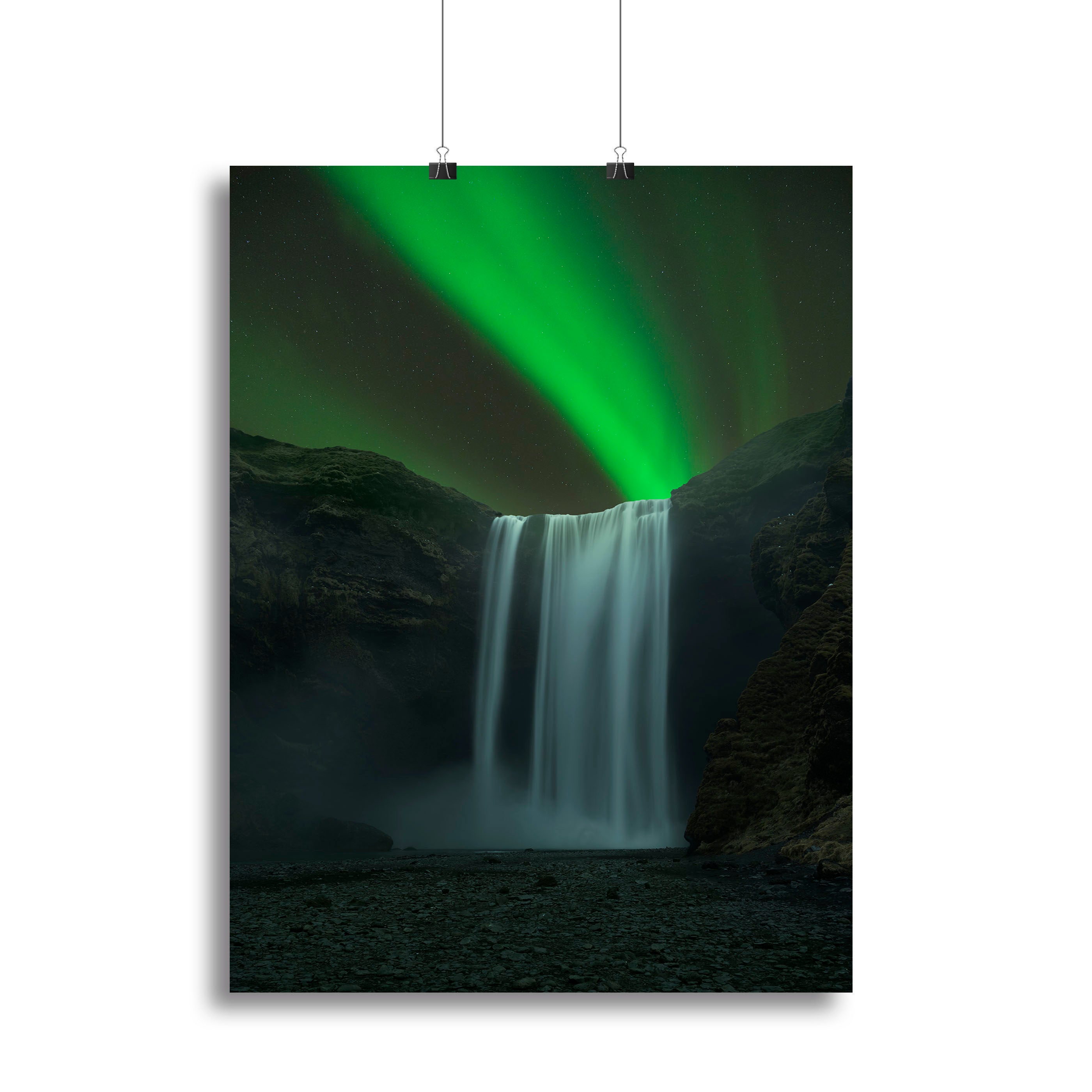 A stunning canvas print of Skogafoss waterfall in Iceland, showcasing its powerful cascade surrounded by lush greenery.