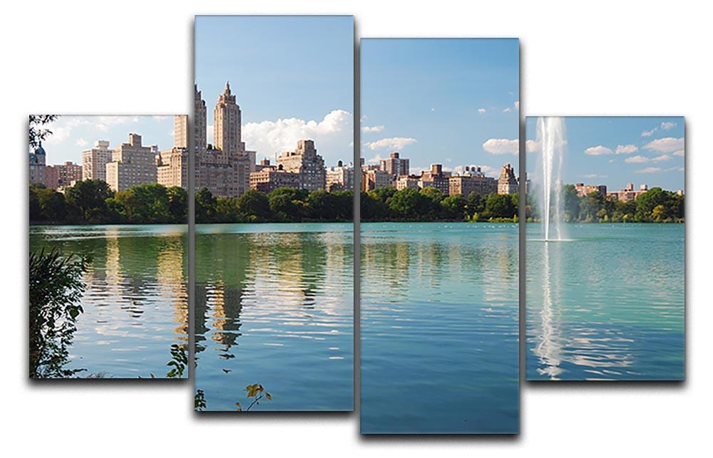 A beautiful 4 split panel canvas artwork depicting a skyline with skyscrapers and trees reflecting on a serene lake.