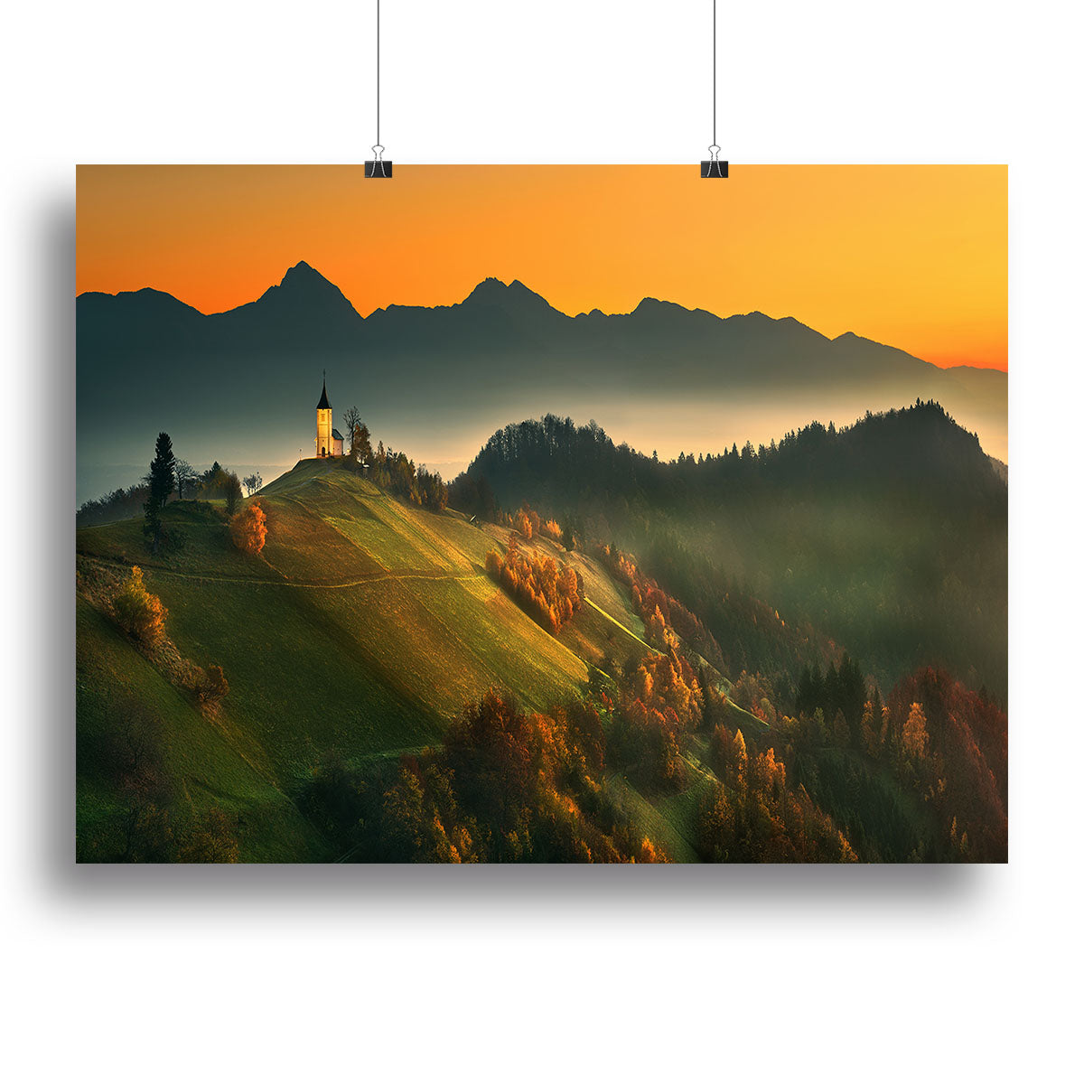 A beautiful canvas print showcasing vibrant autumn colors in Slovenia, featuring trees with orange and yellow leaves against a serene landscape.