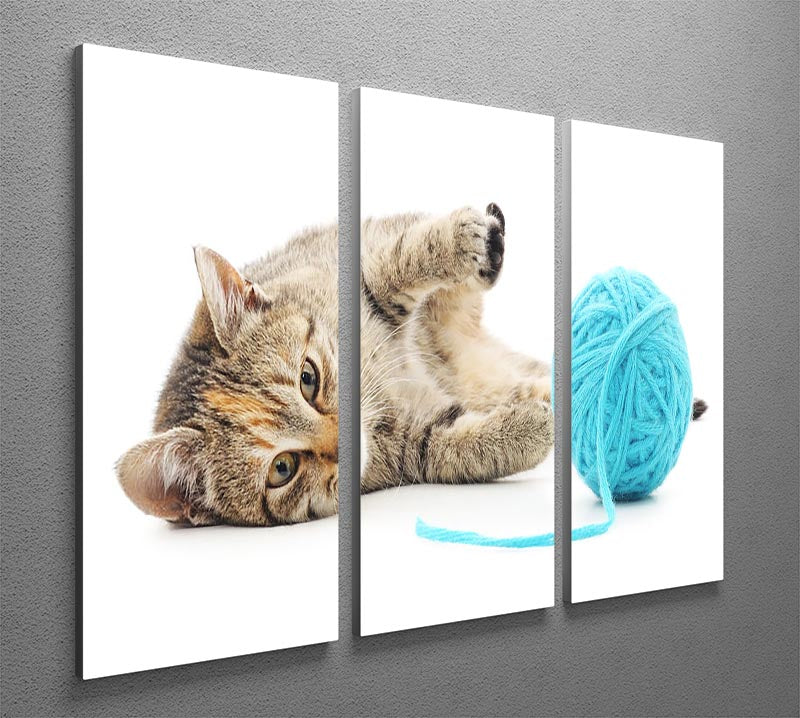 A charming 3-panel canvas print featuring a small funny kitten playing with a colorful clew of thread, perfect for home decor.