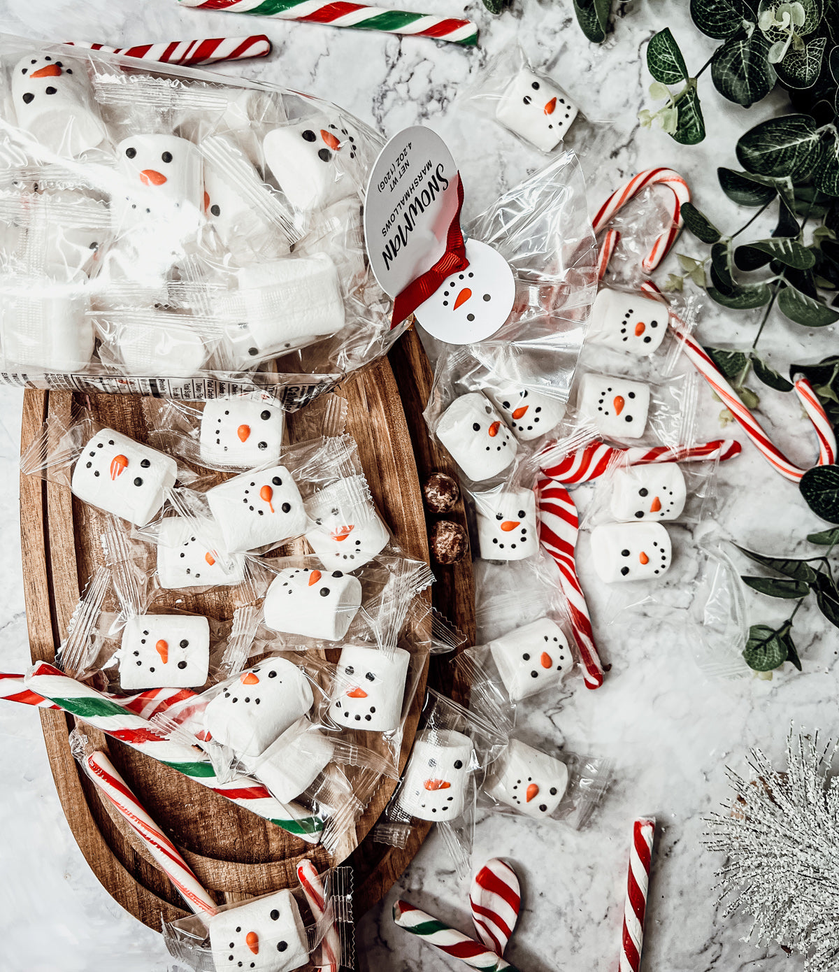 A pack of Snowman Marshmallows featuring fluffy, vanilla-flavored marshmallows shaped like snowmen, individually wrapped for freshness.
