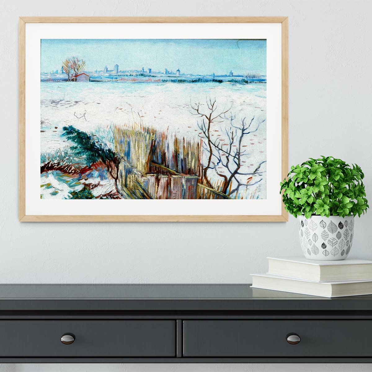 Framed print of Van Gogh's snowy landscape with Arles in the background, showcasing vibrant colors and intricate details.