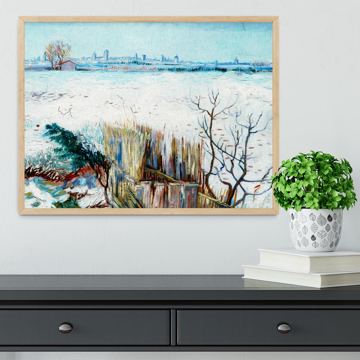 Framed print of Van Gogh's snowy landscape with Arles in the background, showcasing vibrant colors and intricate details.