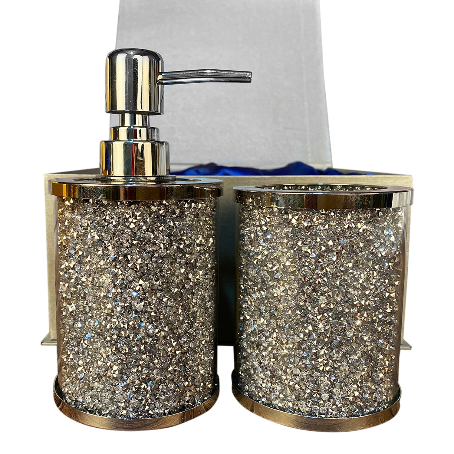 Elegant silver crushed diamond soap dispenser and toothbrush holder set with tray, showcasing modern design and chrome accents.