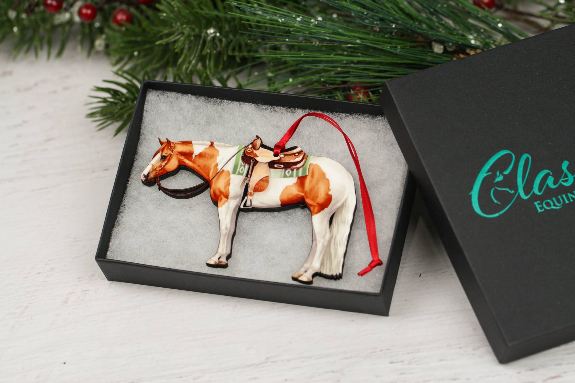 Chestnut and white tobiano Paint Horse ornament made of composite wood, featuring a glossy finish and intricate laser-cut design.