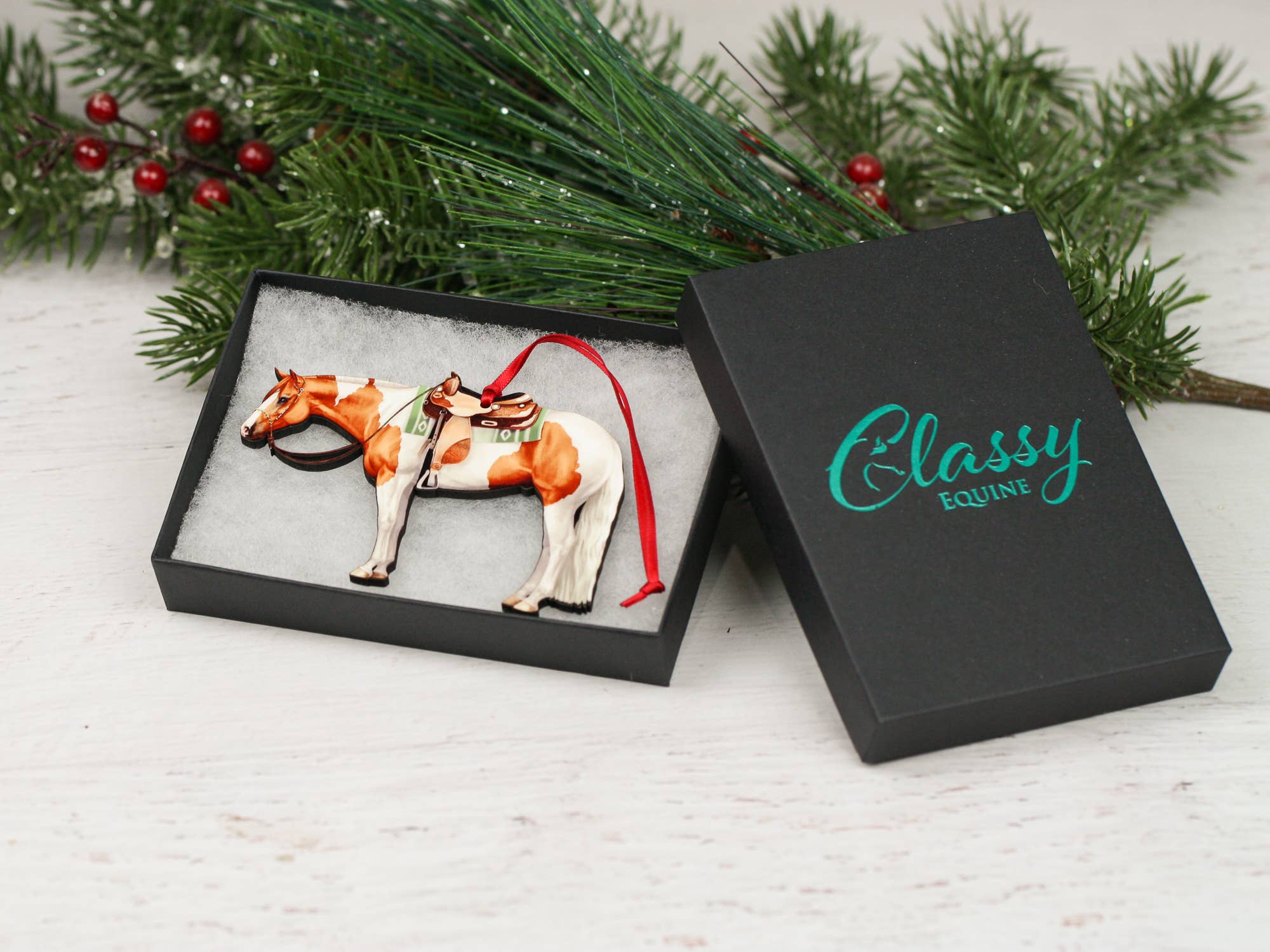 Chestnut and white tobiano Paint Horse ornament made of composite wood, featuring a glossy finish and intricate laser-cut design.