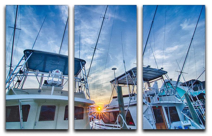 A beautiful 3-panel canvas print depicting sportfishing boats at a marina during early morning, showcasing vibrant colors and serene water reflections.
