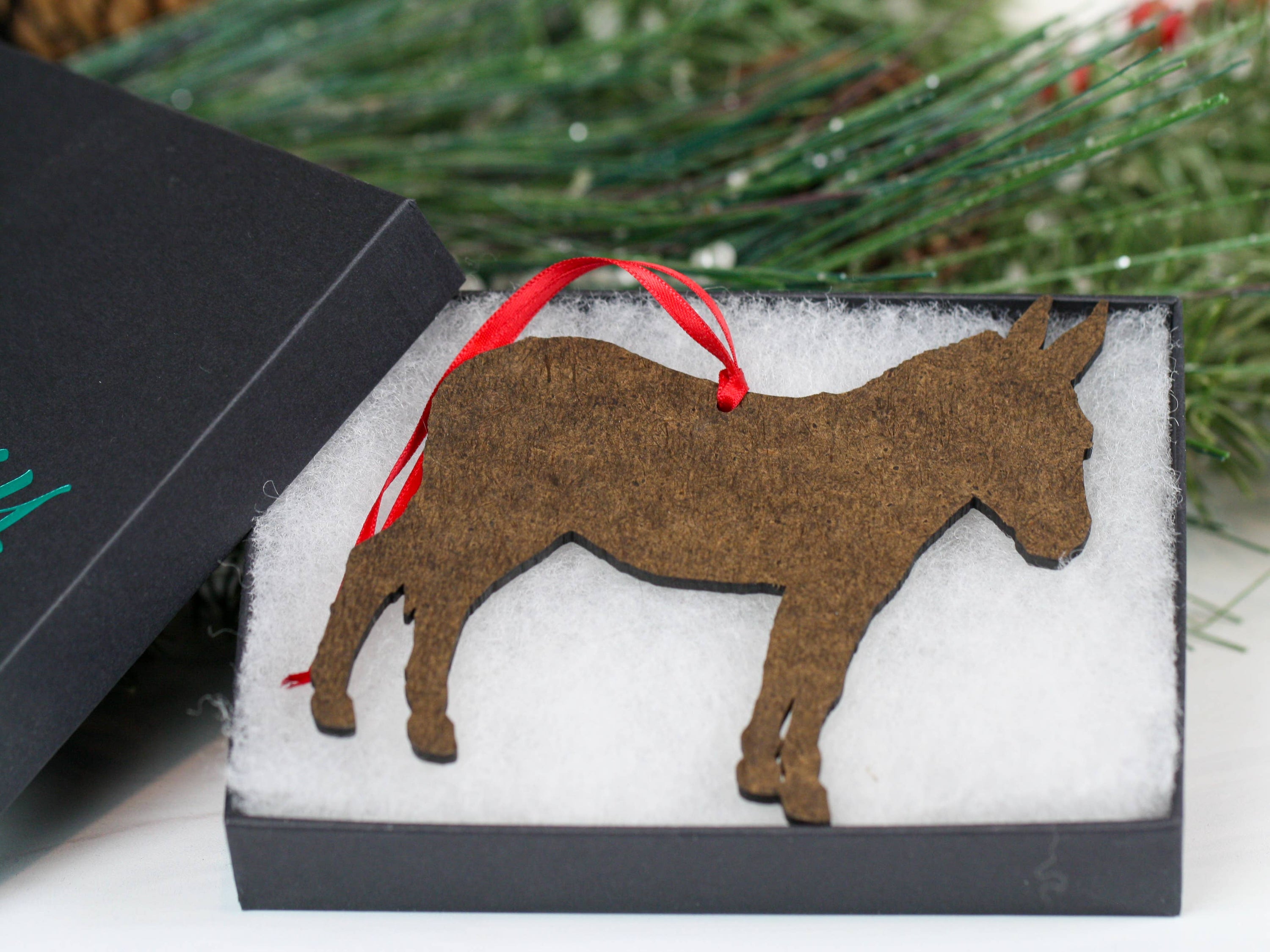 Spotted gray and white Miniature Donkey ornament made from composite wood, featuring a glossy front and dark brown back, perfect for Christmas decor.