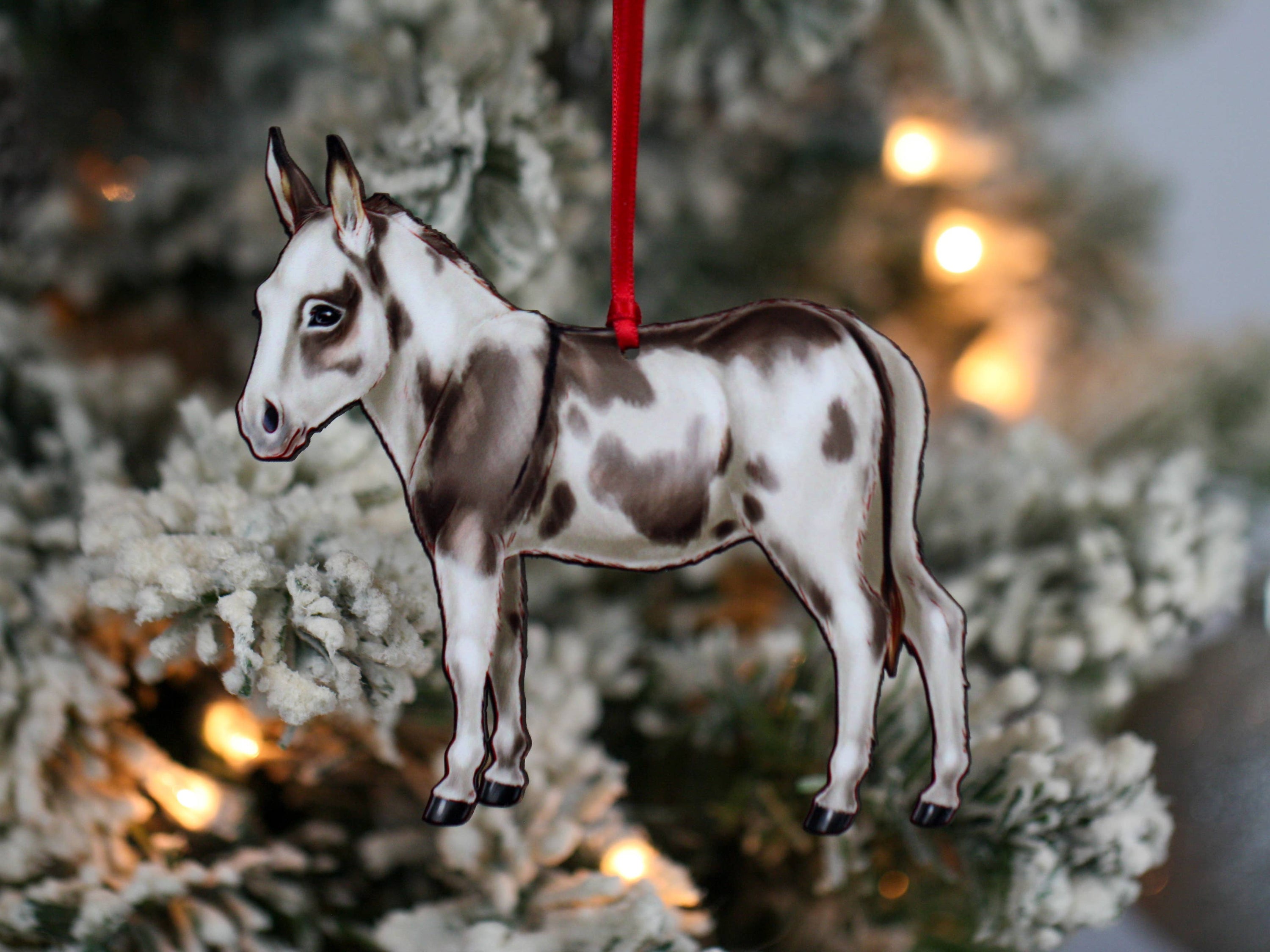 Spotted gray and white Miniature Donkey ornament made from composite wood, featuring a glossy front and dark brown back, perfect for Christmas decor.