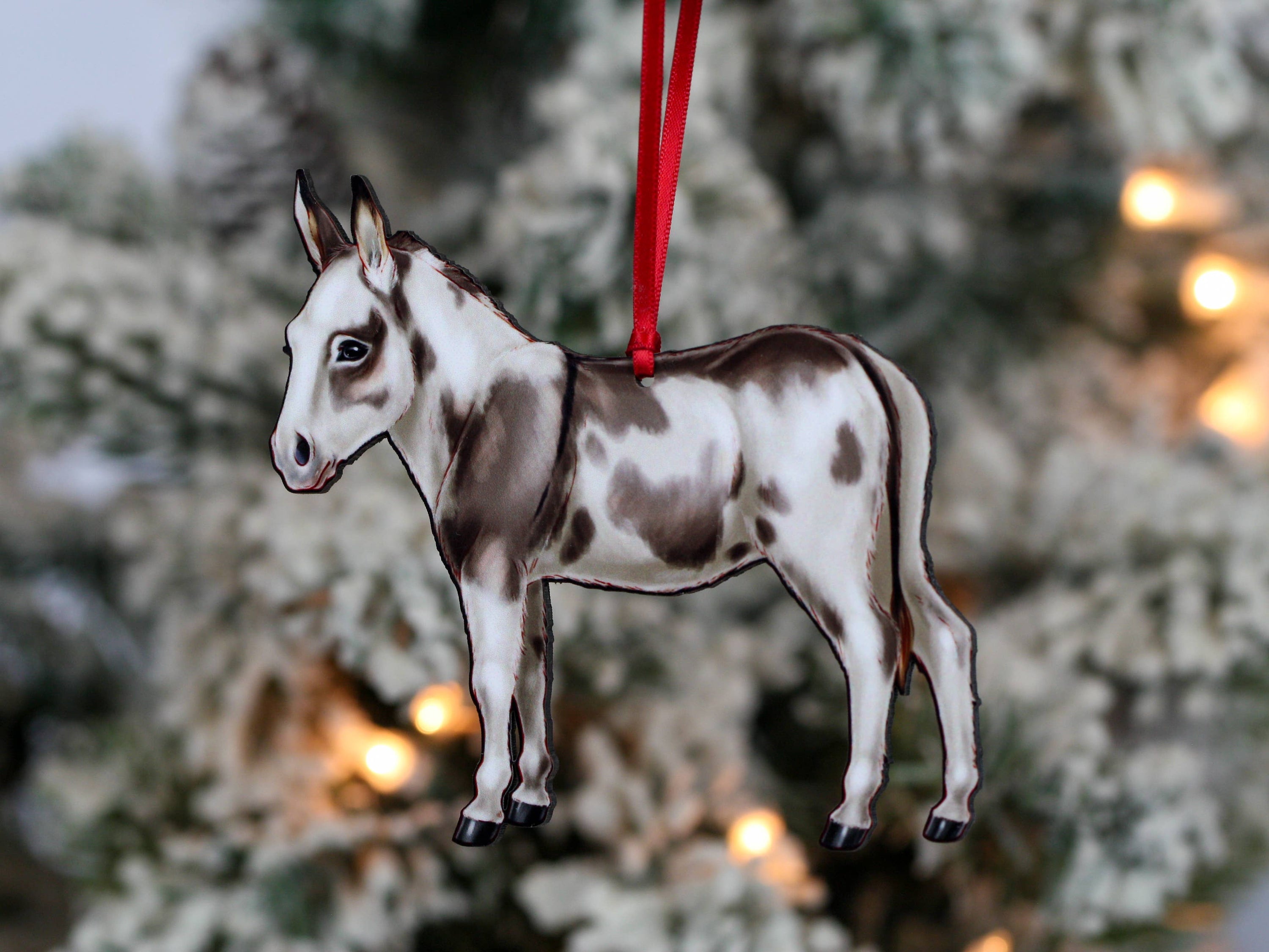 Spotted gray and white Miniature Donkey ornament made from composite wood, featuring a glossy front and dark brown back, perfect for Christmas decor.