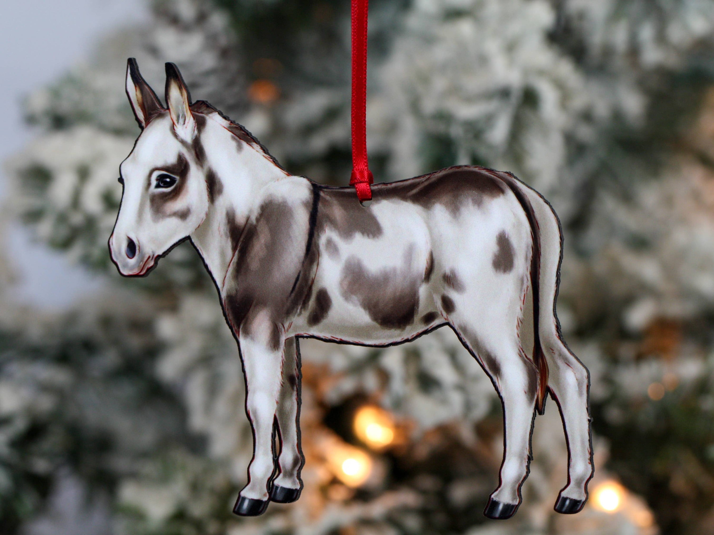 Spotted gray and white Miniature Donkey ornament made from composite wood, featuring a glossy front and dark brown back, perfect for Christmas decor.