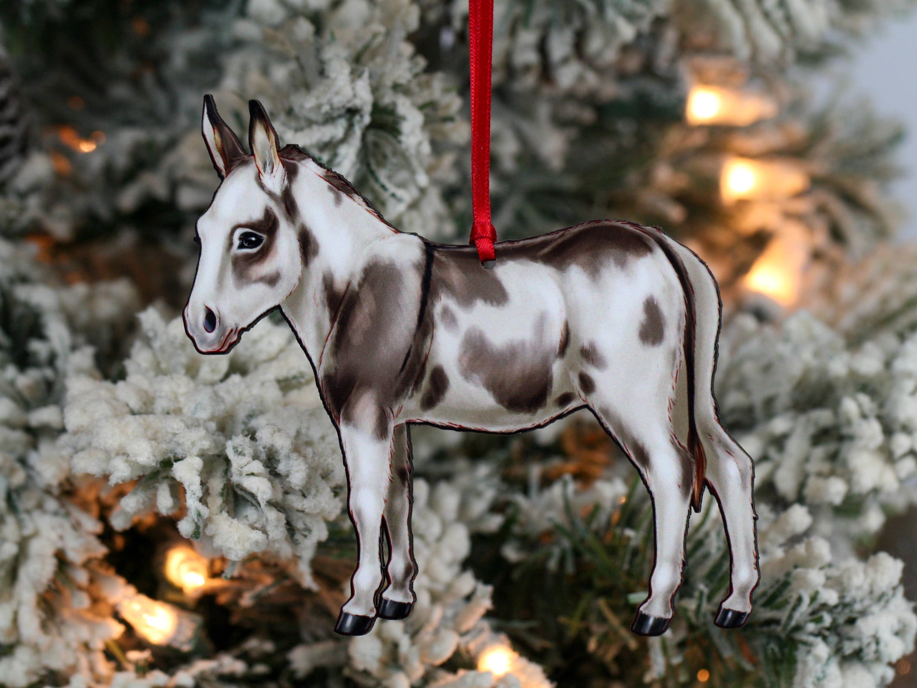 Spotted gray and white Miniature Donkey ornament made from composite wood, featuring a glossy front and dark brown back, perfect for Christmas decor.