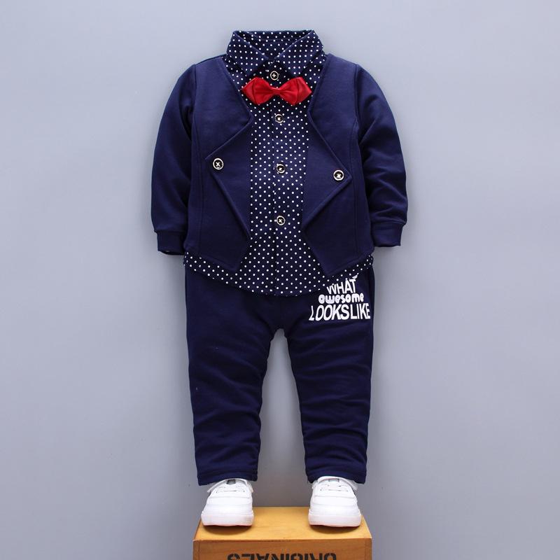 A stylish set of spring autumn clothing for children, featuring a long-sleeve top and pants in a trendy patchwork design, suitable for boys and girls.
