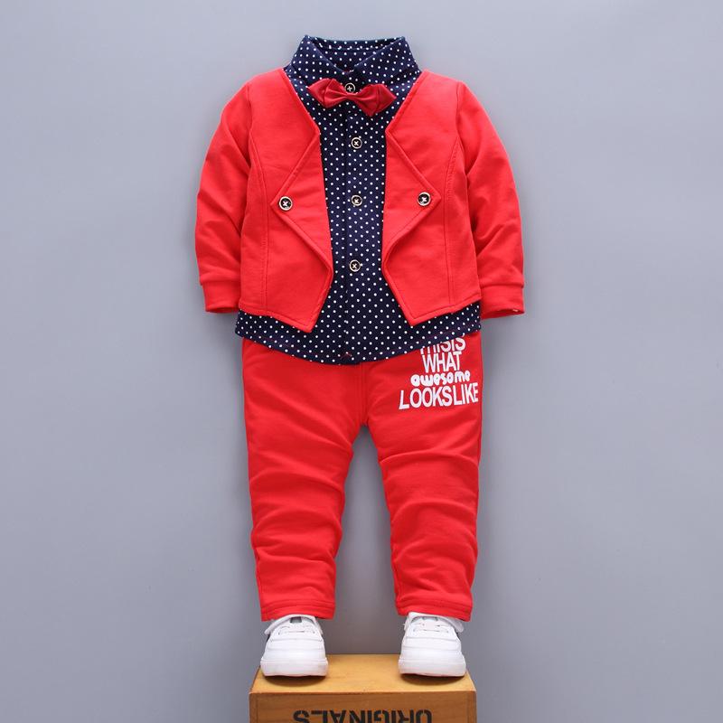 A stylish set of spring autumn clothing for children, featuring a long-sleeve top and pants in a trendy patchwork design, suitable for boys and girls.