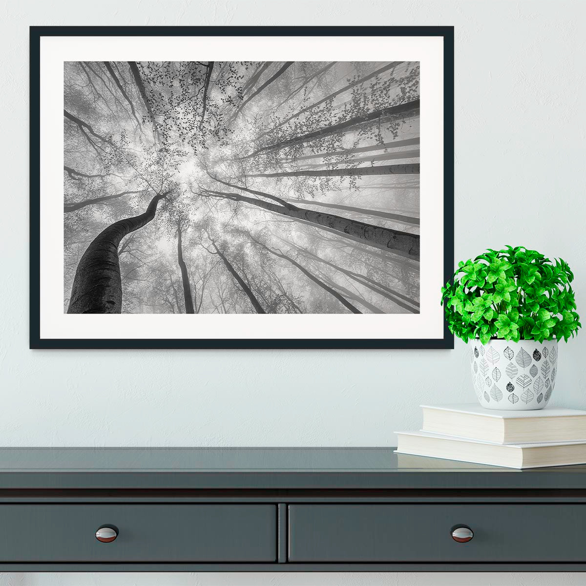 A beautifully framed print of trees in spring, showcasing vibrant colors and a handmade frame in natural wood finish.