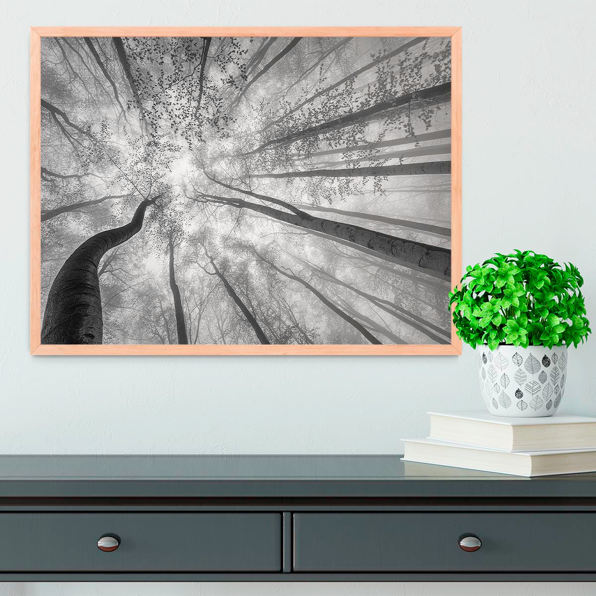 A beautifully framed print of trees in spring, showcasing vibrant colors and a handmade frame in natural wood finish.