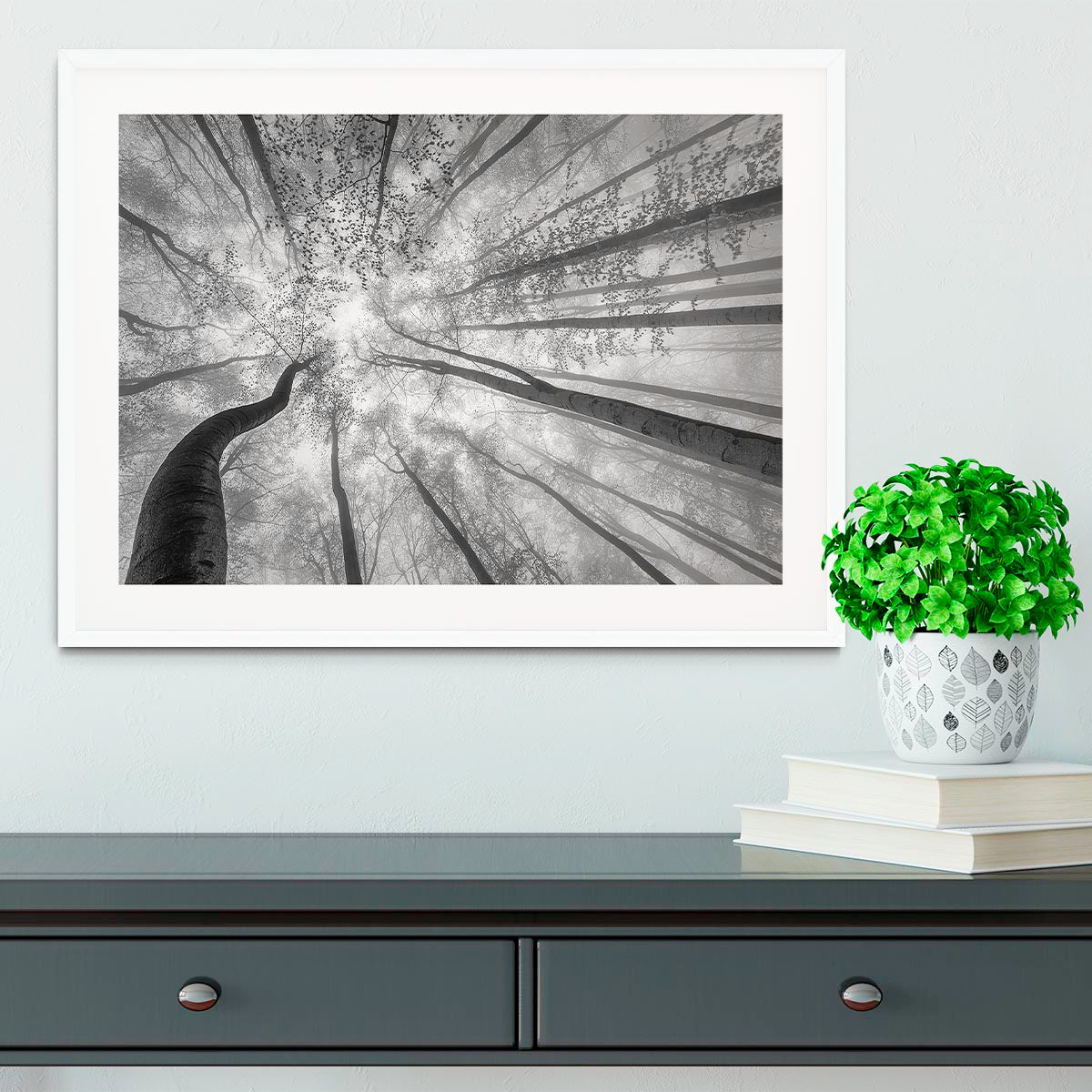 A beautifully framed print of trees in spring, showcasing vibrant colors and a handmade frame in natural wood finish.