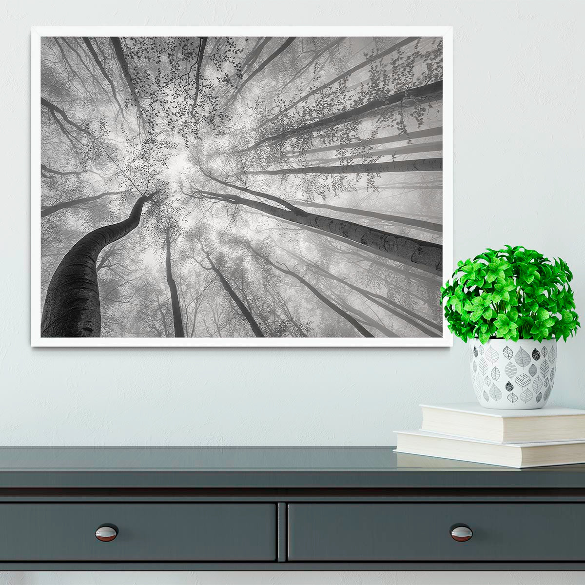 A beautifully framed print of trees in spring, showcasing vibrant colors and a handmade frame in natural wood finish.