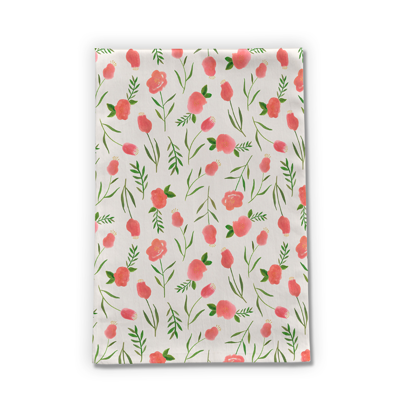A colorful Spring Watercolor Tea Towel featuring floral designs on a cotton twill fabric, perfect for kitchen use.