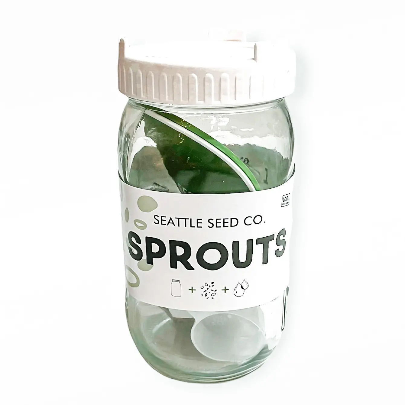 Sprouting Starter Kit featuring a quart-size jar, straining lid, mixed seeds, coaster, and measuring scoop for home sprouting.
