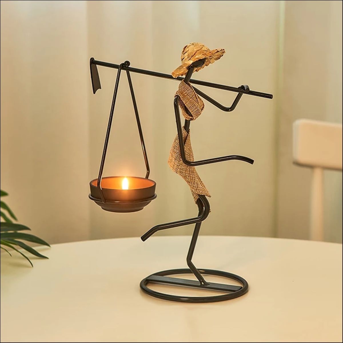 A stylish standing woman stick candle holder made of wrought iron, featuring a female figurine design, perfect for table decor.
