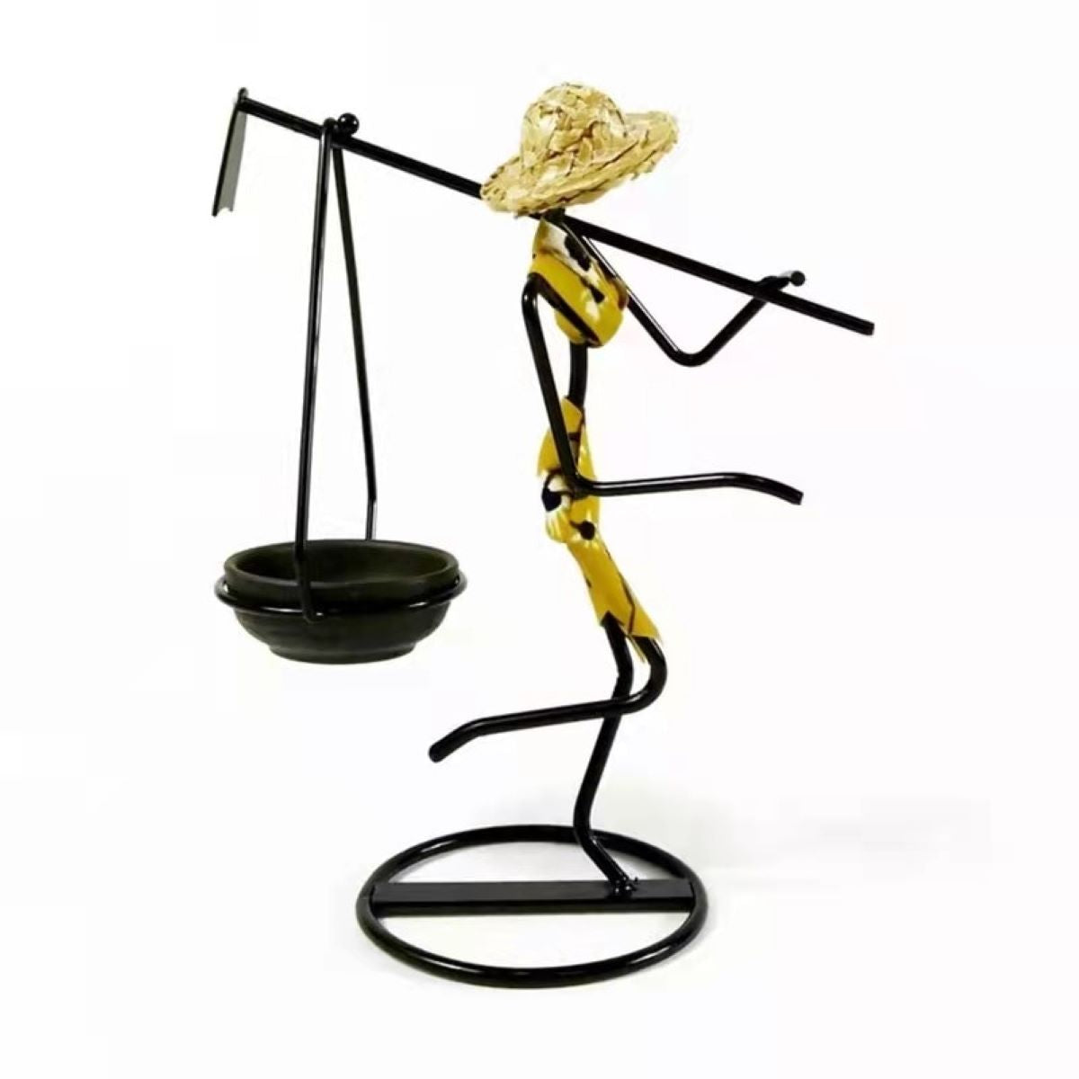 A stylish standing woman stick candle holder made of wrought iron, featuring a female figurine design, perfect for table decor.