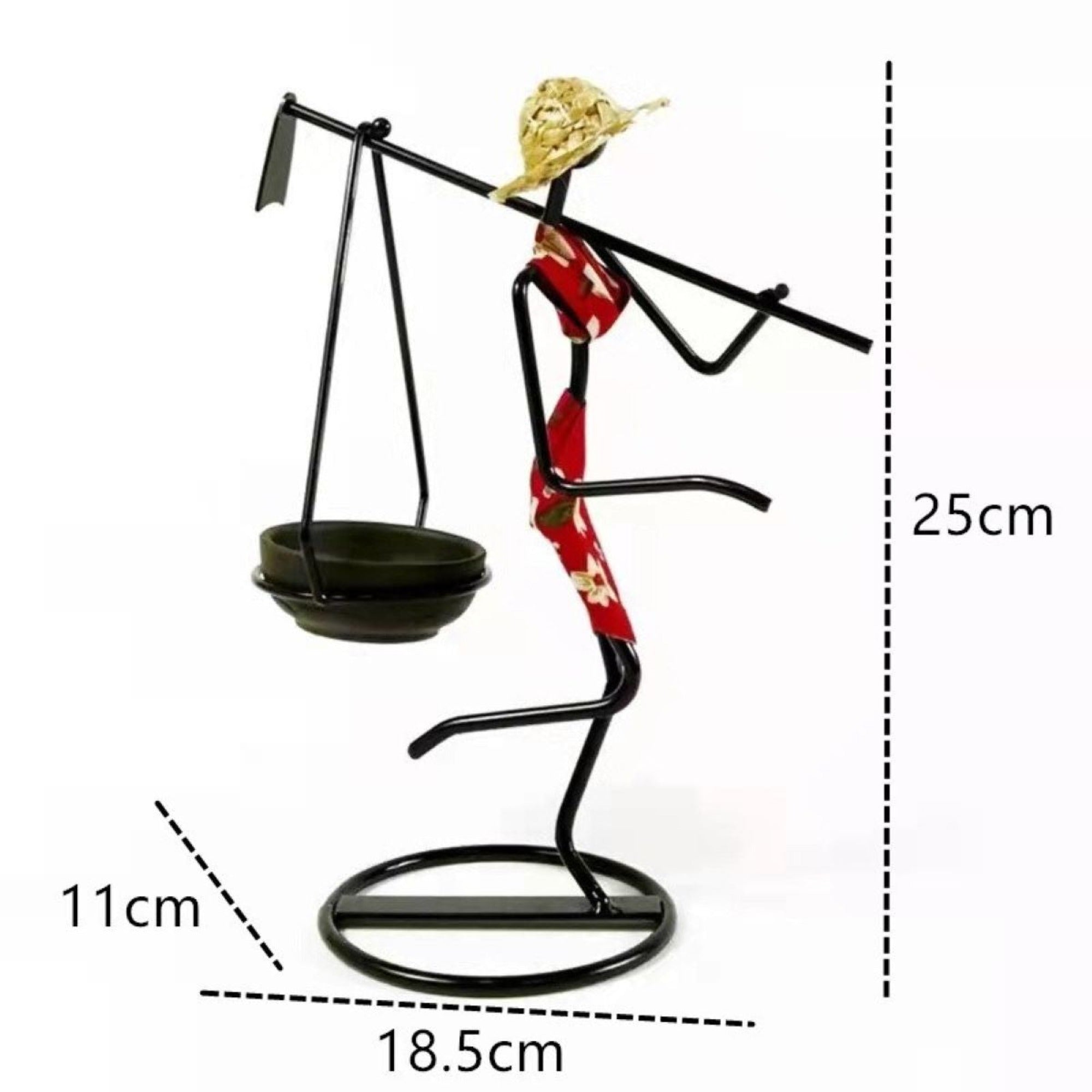 A stylish standing woman stick candle holder made of wrought iron, featuring a female figurine design, perfect for table decor.