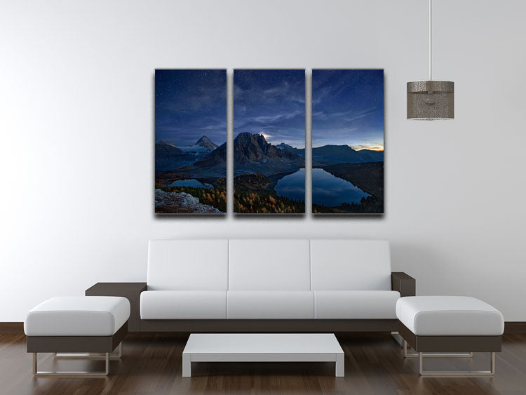 Starry Night At Mount Assiniboine 3-panel canvas print showcasing a beautiful night sky over a mountain landscape.