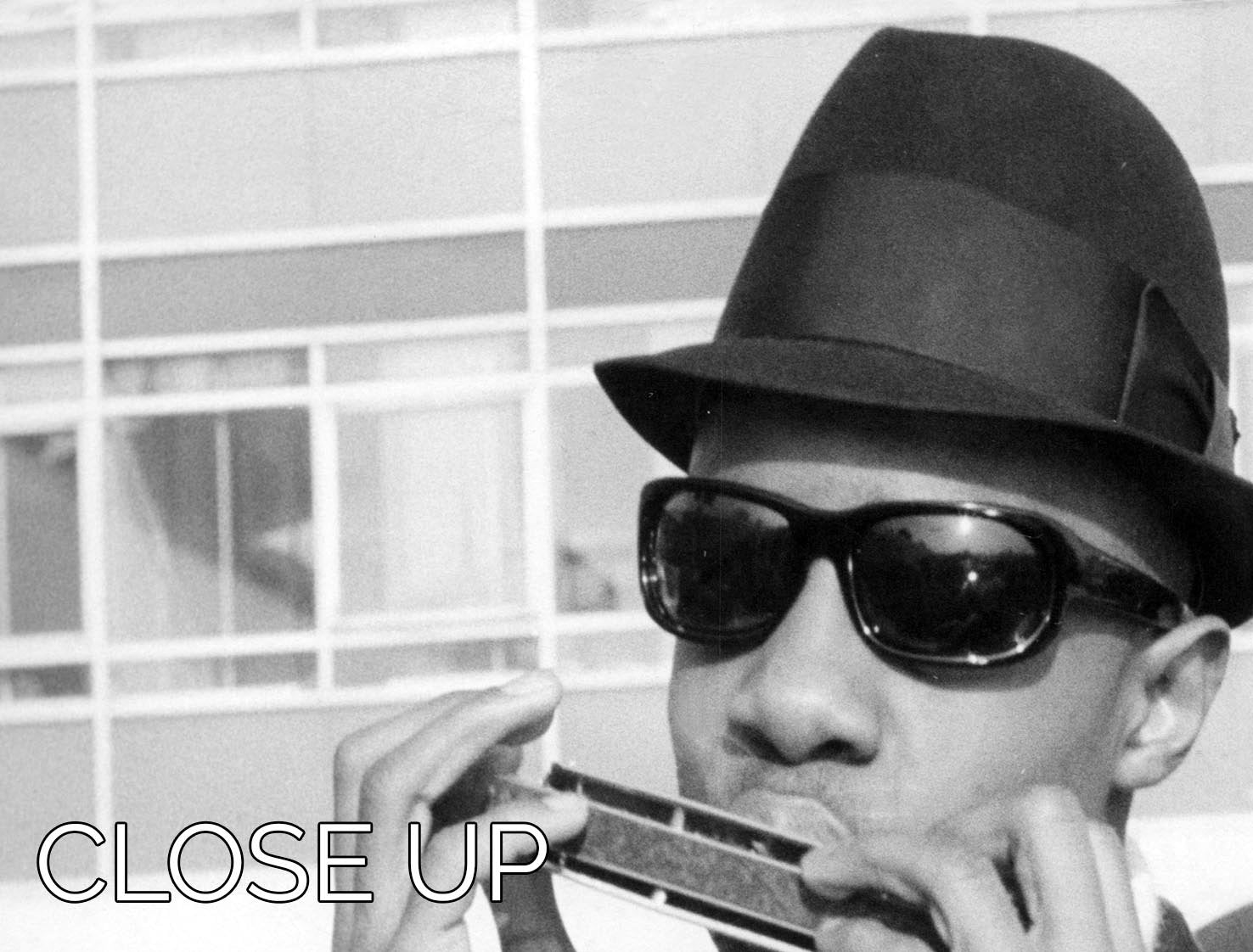 A stunning 3-panel canvas print featuring Stevie Wonder playing the harmonica, showcasing vibrant colors and artistic design.