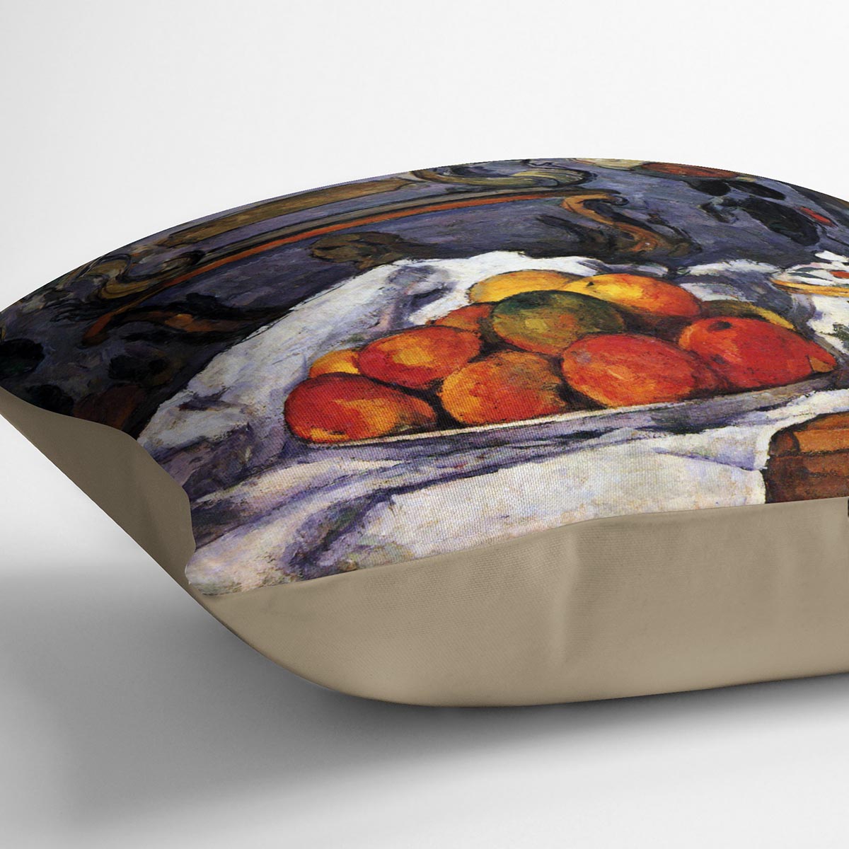 A decorative cushion featuring Cezanne's still life bowl of apples design, made from luxurious vegan faux suede.