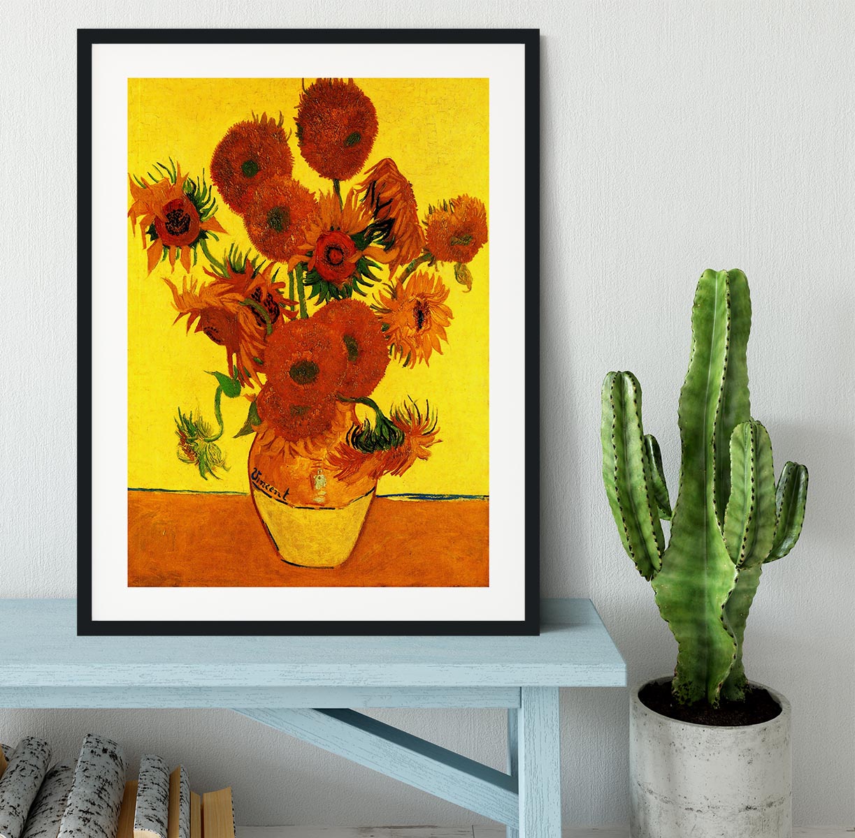 Framed print of Van Gogh's Still Life Vase with Fifteen Sunflowers, showcasing vibrant colors and intricate details.