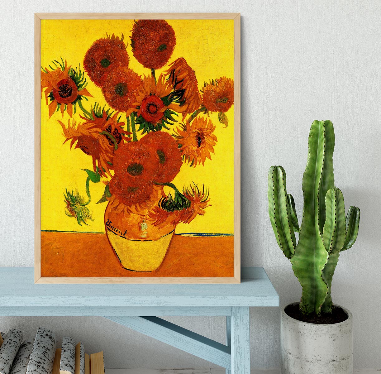 Framed print of Van Gogh's Still Life Vase with Fifteen Sunflowers, showcasing vibrant colors and intricate details.
