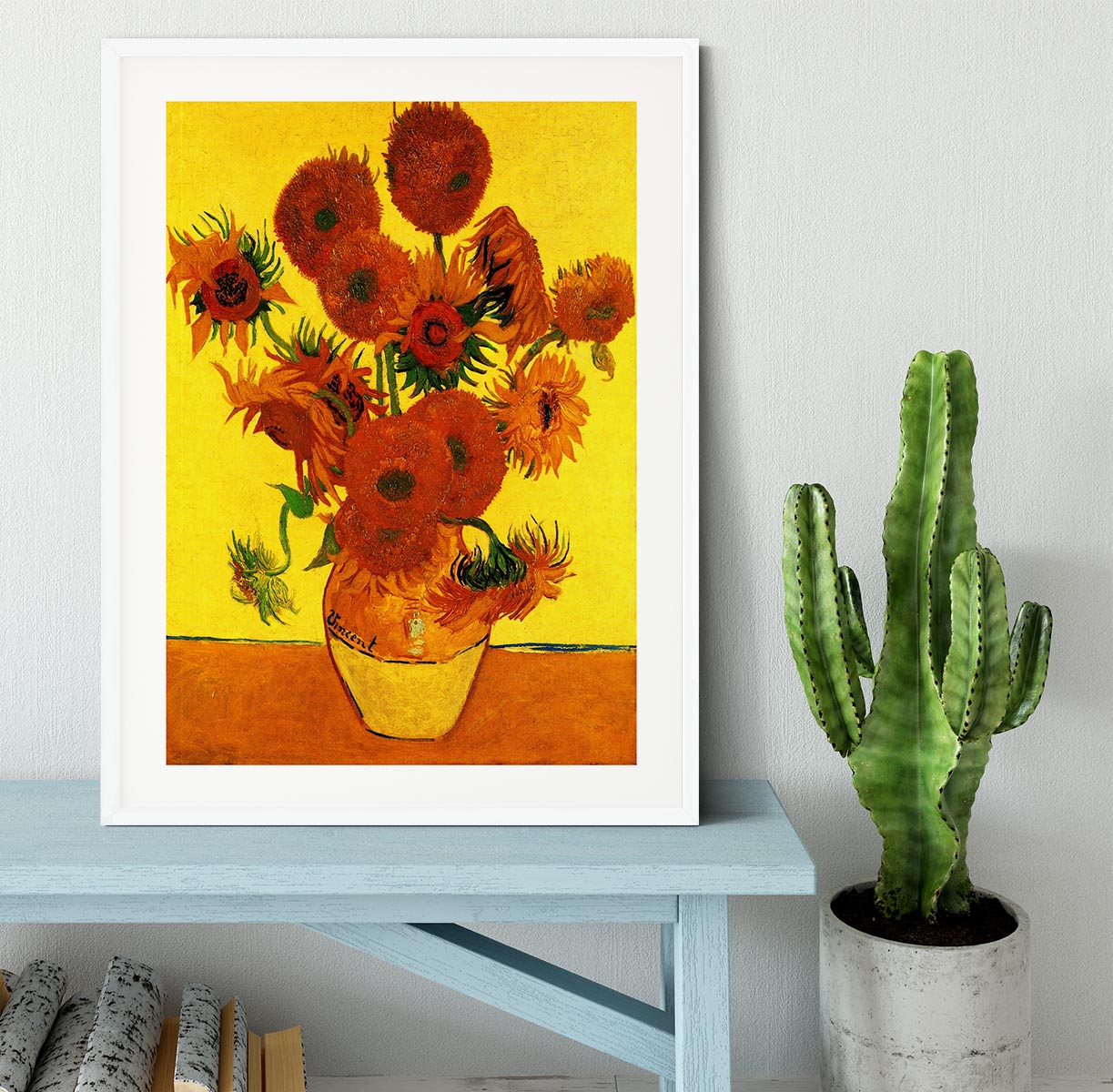 Framed print of Van Gogh's Still Life Vase with Fifteen Sunflowers, showcasing vibrant colors and intricate details.