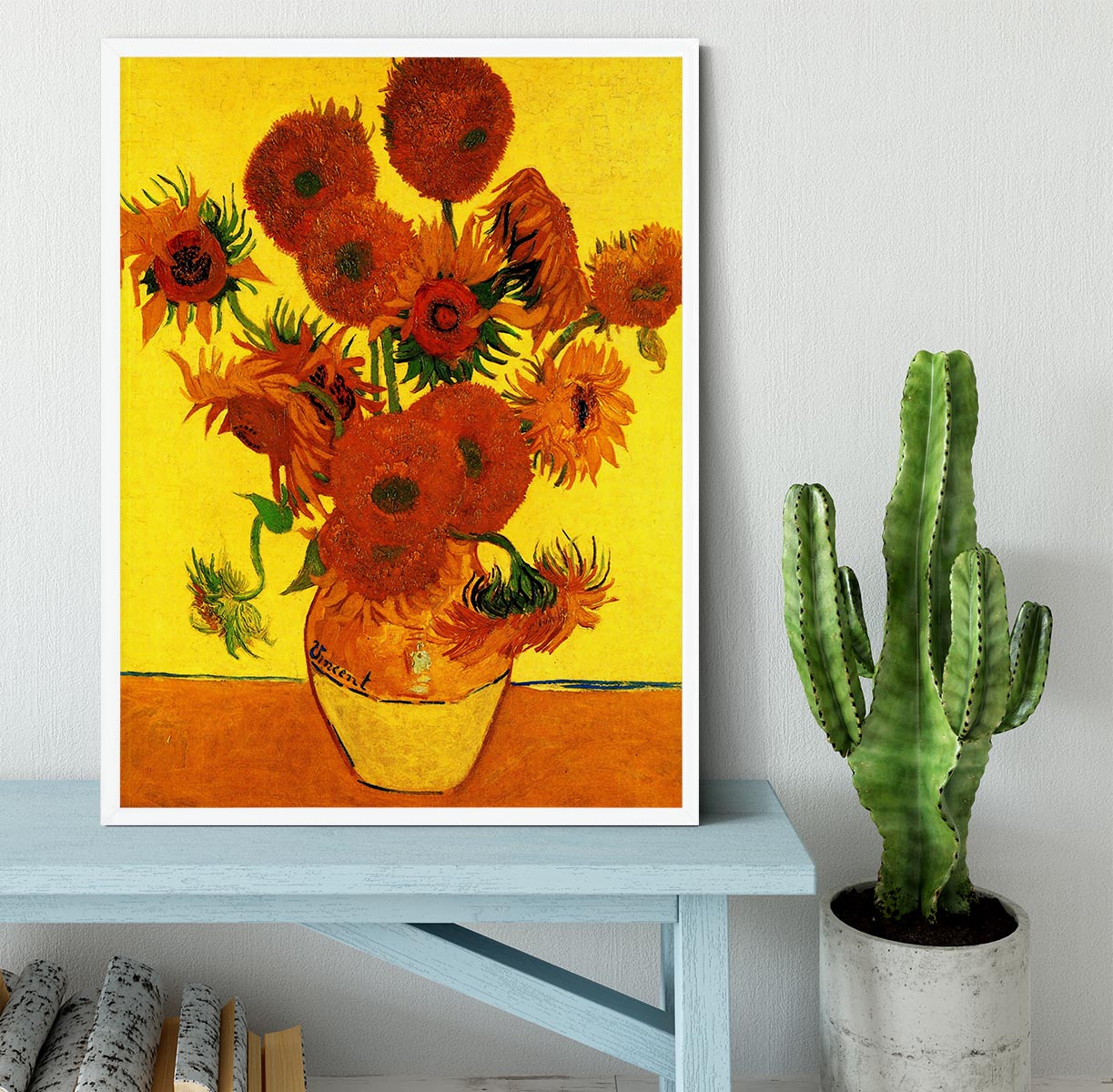 Framed print of Van Gogh's Still Life Vase with Fifteen Sunflowers, showcasing vibrant colors and intricate details.