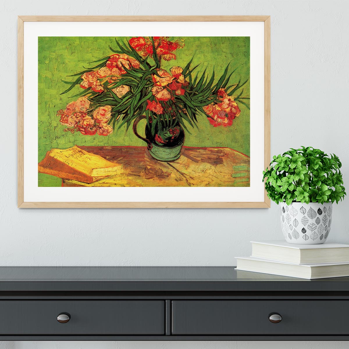 Framed print of Van Gogh's Still Life Vase with Oleanders and Books, showcasing vibrant colors and intricate details.