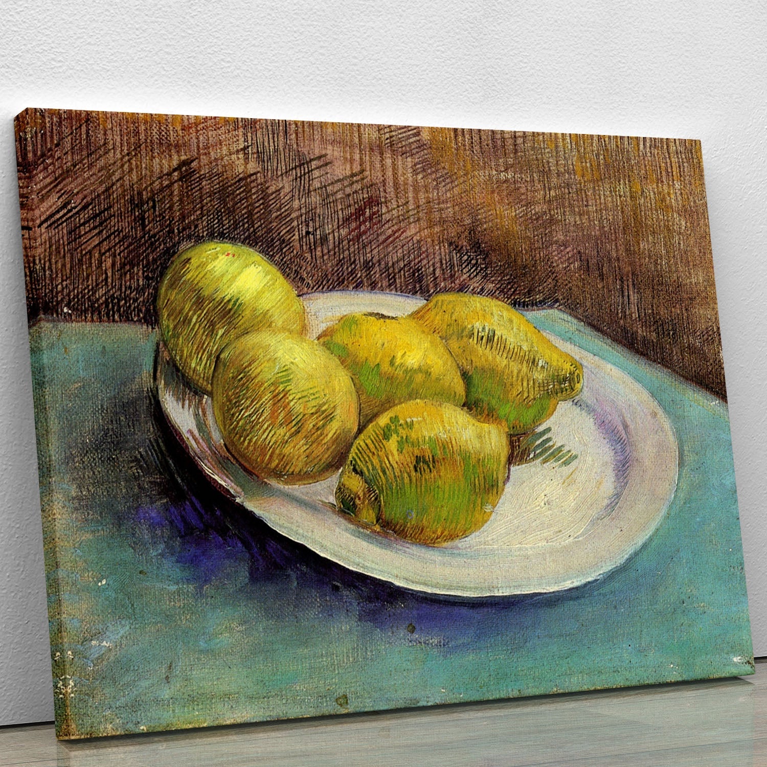 Canvas print of Van Gogh's Still Life with Lemons on a Plate, showcasing vibrant lemons on a plate with a textured background.