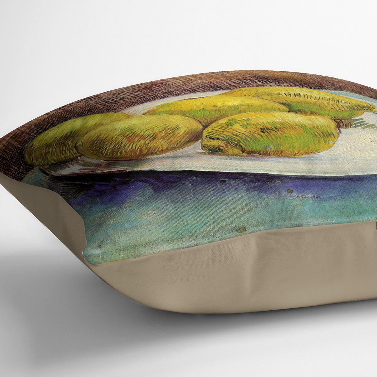 A vibrant cushion featuring Van Gogh's Still Life with Lemons on a Plate design, made from luxurious vegan faux suede.