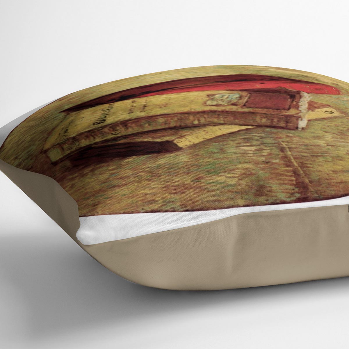 A vibrant cushion featuring Van Gogh's Still Life with Three Books design, made from luxurious vegan faux suede.