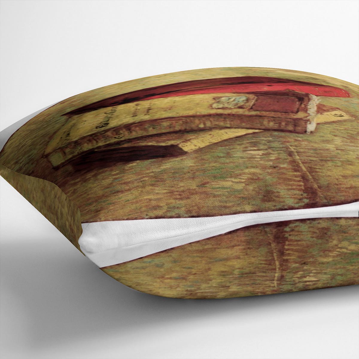 A vibrant cushion featuring Van Gogh's Still Life with Three Books design, made from luxurious vegan faux suede.