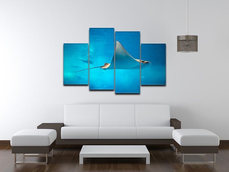A beautiful 4-split canvas artwork featuring a stingray swimming gracefully in an aquarium setting, showcasing vibrant colors and dynamic design.
